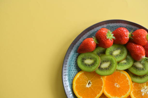 istock Top view over a plate filled with colorful fruit 1728186531