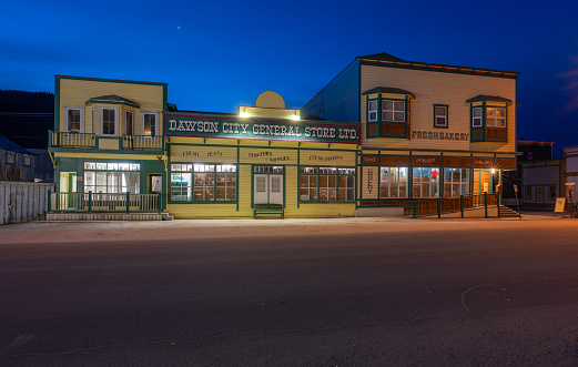 Dawson City, Yukon, Canada – October 05, 2023:  Dawn view of the Dawson City General Store on Front Street