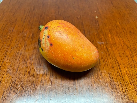 Ripe mango on desk