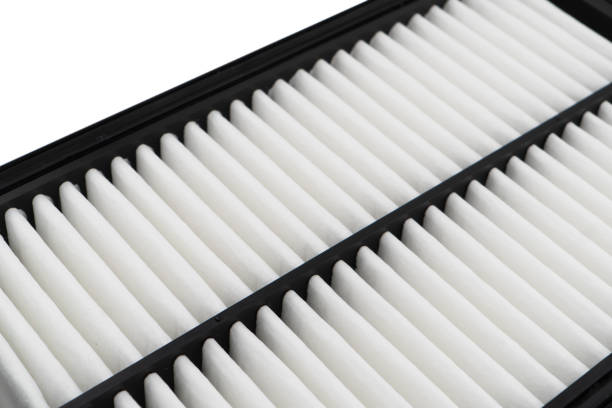 istock New car air filter element. Car engine air filter texture background. Close-up air filter isolated. Quality spare parts for car service or maintenance 1728236989