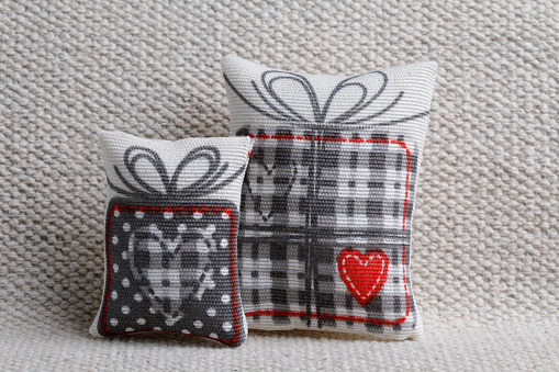 pillow red heart shaped  on white sofa
