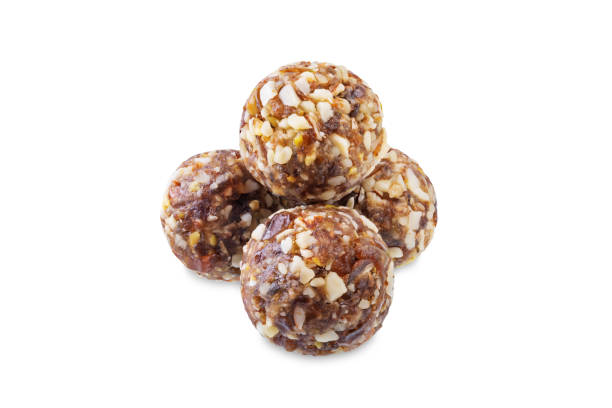 istock Dates and nuts raw healthy balls on a white isolated background 1728249444