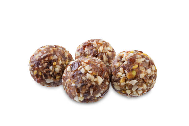istock Dates and nuts raw healthy balls on a white isolated background 1728249954