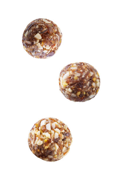 istock Dates and nuts raw healthy balls on a white isolated background 1728249955