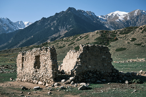 Old ruined building in mountain valley