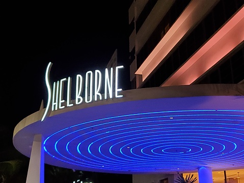 In Miami Beach, United States the historic Shelborne Hotel is clearly marked with illuminated signage in the Art Deco district at night.