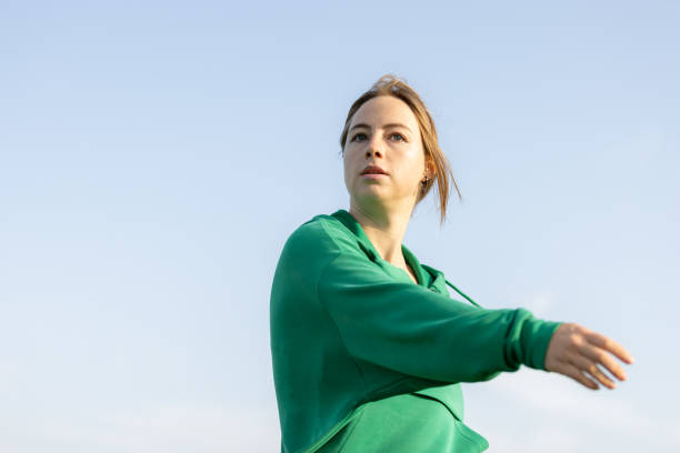 istock Young female athlete is stretching before training. 1728288789