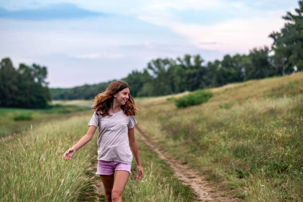 istock Girl enjoys in nature 1728298410