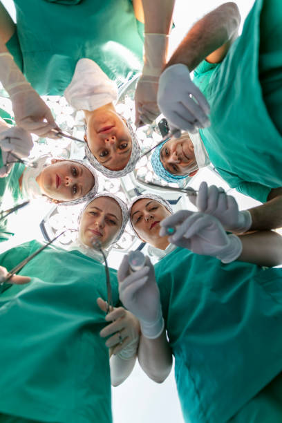 istock Team of nurses and surgeons in surgery. 1728299503
