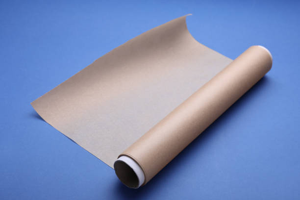 istock Roll of baking paper on blue background 1728308996