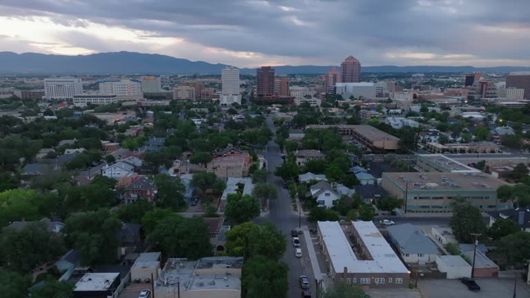 Albuquerque, New Mexico skyline at dawn. Aerial descending shot of city in Southwest USA during morning.