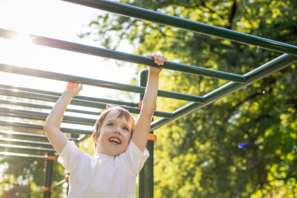 istock 6 year old boy doing sports training on the playground 1728336052
