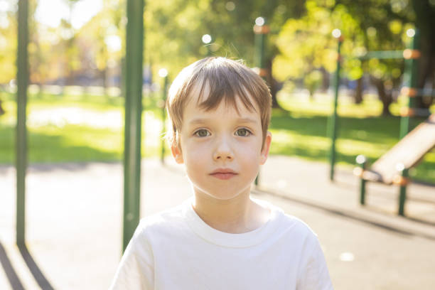 6 year old boy doing sports training on the playground