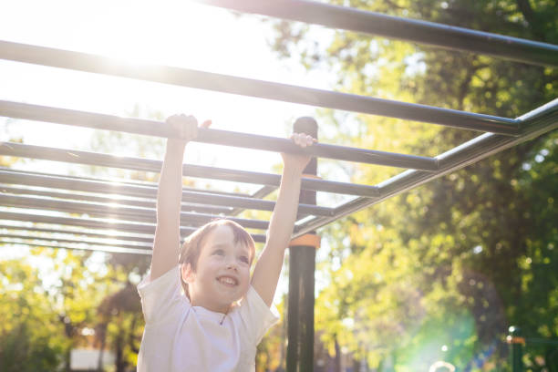 istock 6 year old boy doing sports training on the playground 1728351173
