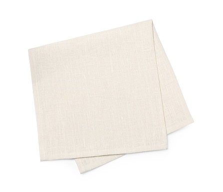 Beige fabric napkin on white background, top view