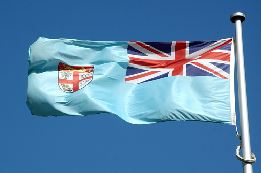 the flag of Fiji against blue sky