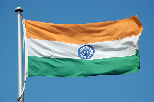 the flag of India against blue sky