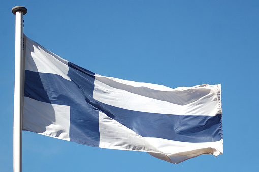 the flag of Finland against blue sky