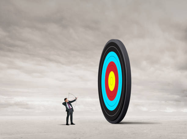 istock Man Pointing Bow And Arrow  Up Toward A Target 1728388704