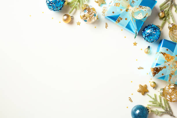 istock Modern Christmas background with gift boxes, blue and gold Xmas decorations and gift boxes on white background. 1728392394