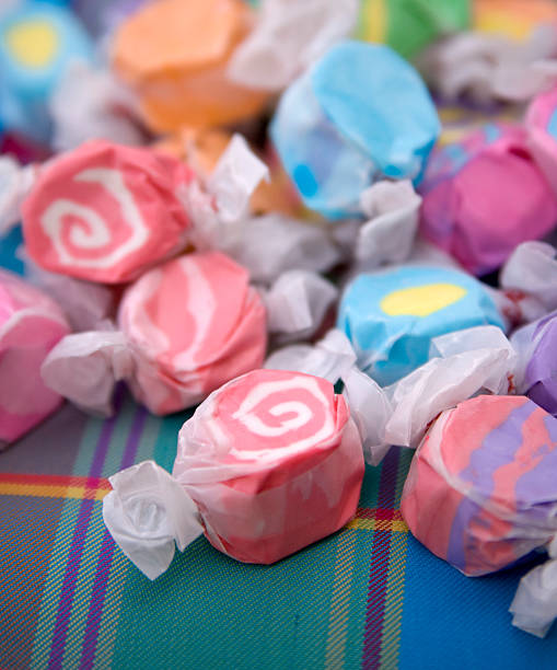 istock Assorted Wrapped Salt Water Taffy Candy Background on Picnic Blanket 172843199