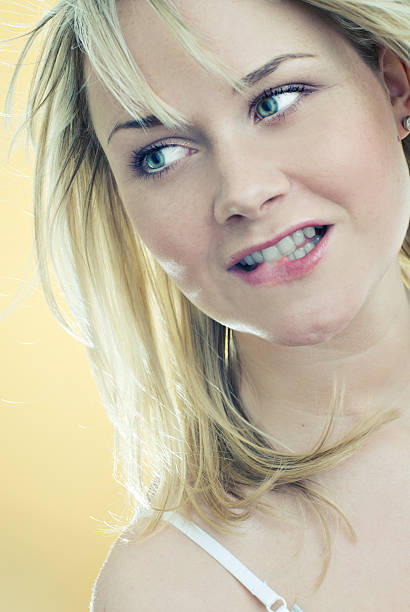 istock Young woman biting her lip 172843765