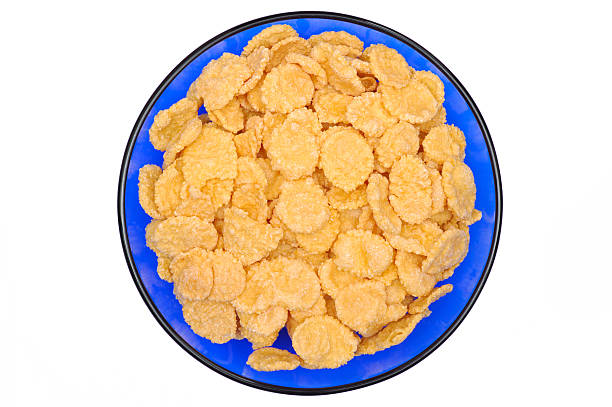 istock Corn-flakes in a blue cup. Top view. Isolated on white 172844168