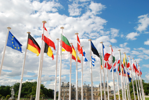 Flags of Belgium and the European Union waving on a clear day. Democracy and politics. European country. 3D illustration render