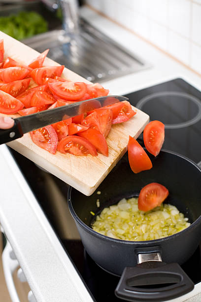 istock Cooking: Pouring Tomatos in a Pot 172844733