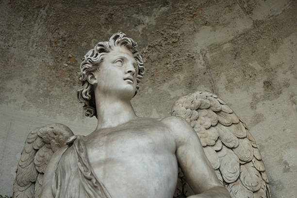 White Marble Angel Looks Out From Dusty Alcove