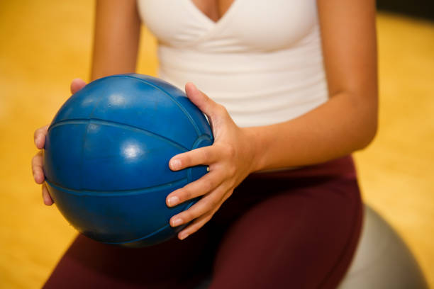 istock Woman with Medicine Ball 172845576