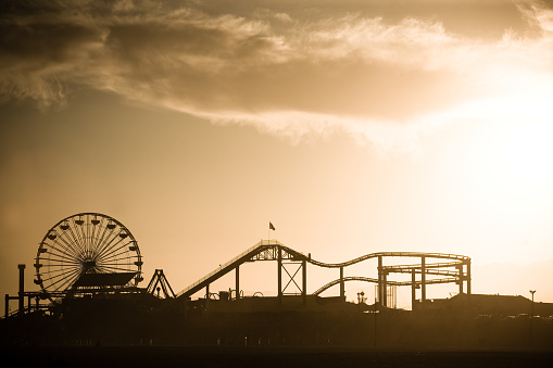 Desaturated silhouette of the Santa Monica Pier at sunset.