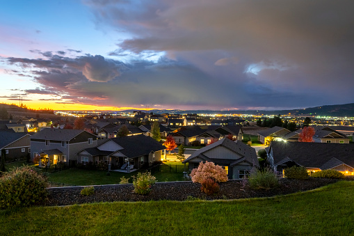 Sunset evening view from a new home subdivision looking over Spokane and Spokane Valley from a hilltop in Liberty Lake, Washington, USA. Liberty Lake is a city in Spokane County, Washington, United States located adjacent to the eponymous lake. Located just over a mile west of the Washington–Idaho border, Liberty Lake is both a suburb of Spokane, Washington and a bedroom community to Coeur d'Alene, Idaho.