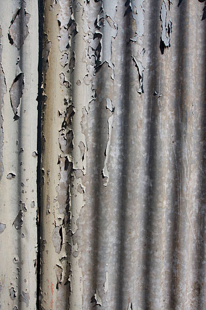 Peeling Paint off Corrugated Iron Sheet stock photo