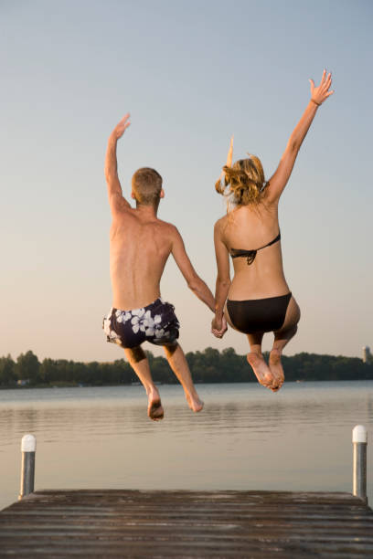 istock Teens jump in the lake. 172846831