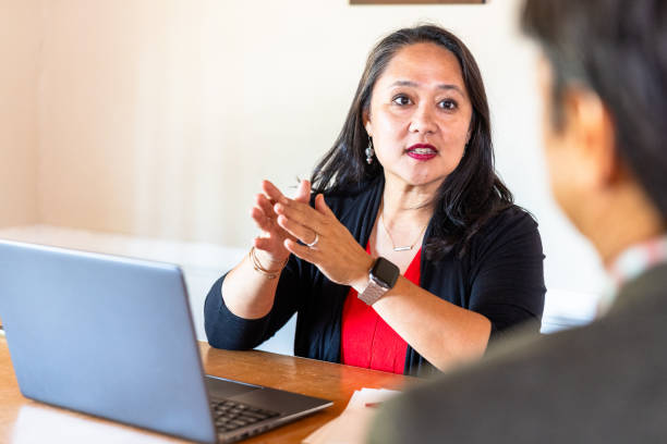 istock Mature Filipino Woman Using Financial Technology 1728472127