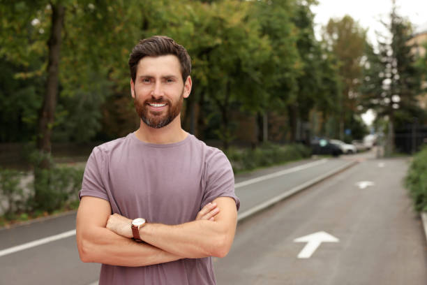 istock Portrait of handsome bearded man on street, space for text 1728474521