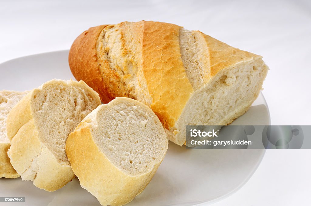 sliced french bread sliced french bread isolated on white Baguette Stock Photo