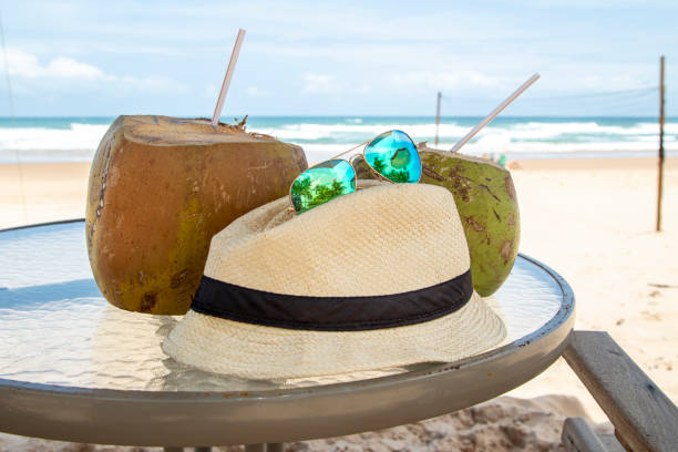 Collecion of summer objects over a table at a brazilian beach during a sunny day