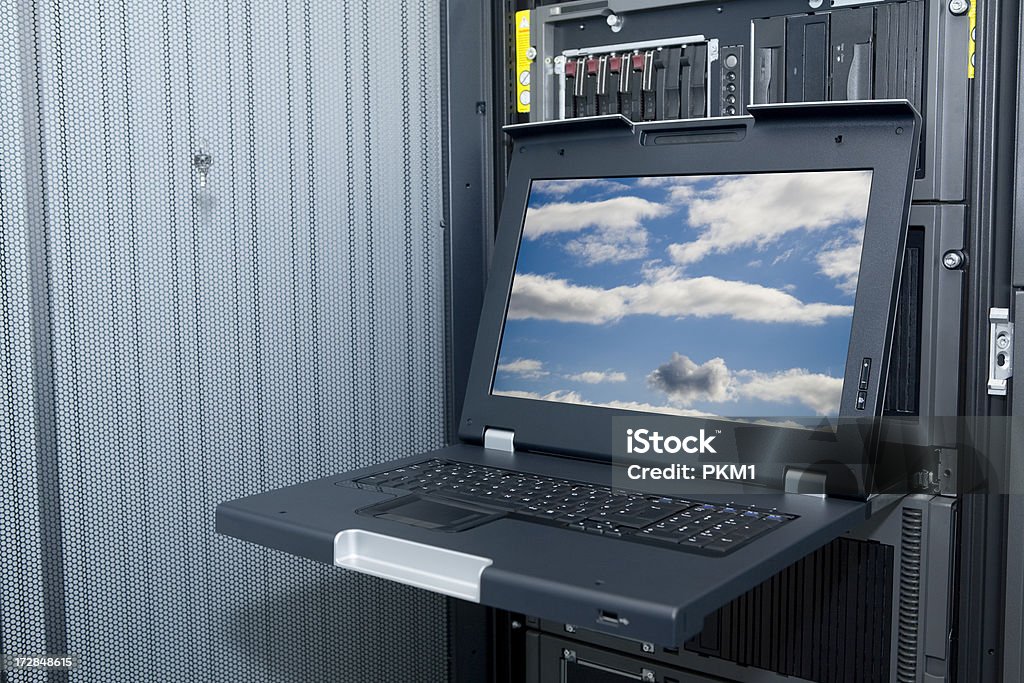 Slide out Laptop (with path) "HP Proliant rack mounted servers with hot swap drives, slide out rack mounted laptop fitted between them, clipping path to screen area add your own image." Backup Stock Photo
