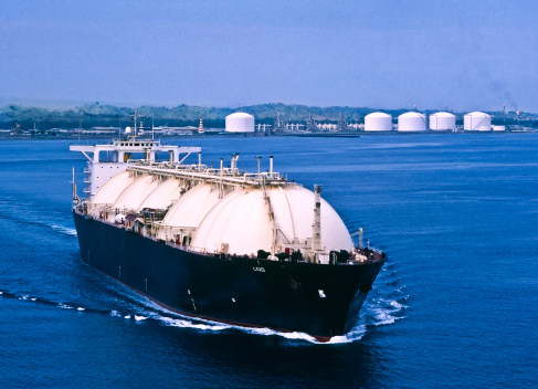 LNG Tanker leaving Asian liquefaction plant to deliver natural gas to consumers.
