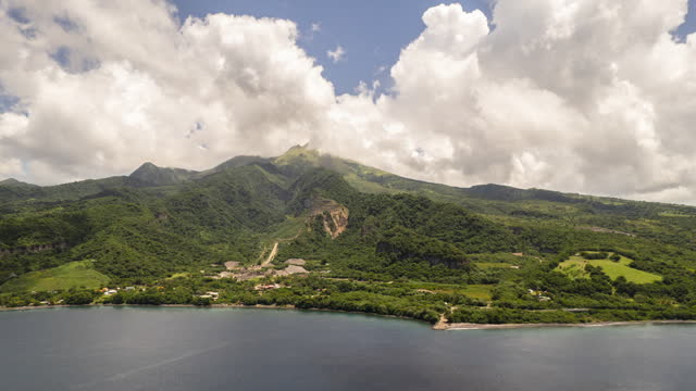 Hyperlapse of mount Pelée in Martinique with fast moving clouds and a blue sky