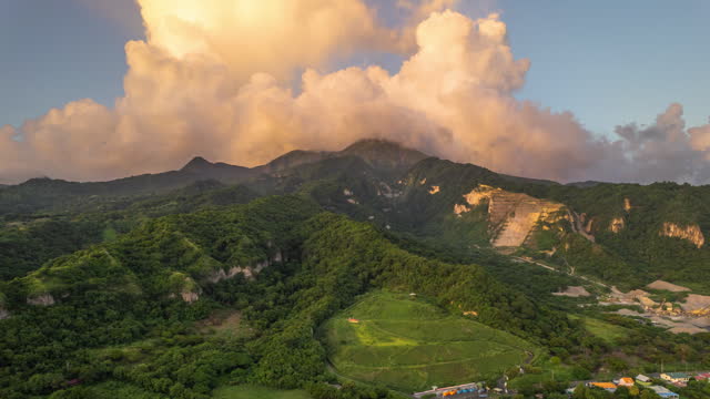 Hyperlapse of mount Pelée in Martinique with fast moving clouds during sunset