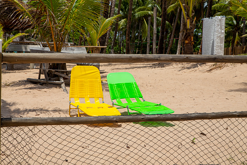 Colorful beach sun chair at the facade of a typical northeastern brazilian resort