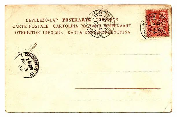 The reverse of a postcard posted in Paris in 1903. It also bears a London postmark.
