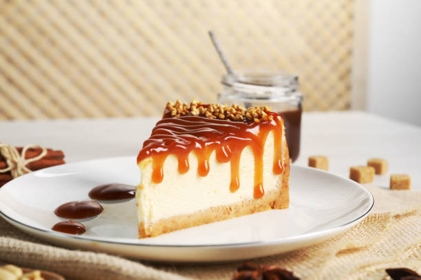 istock Tasty cheesecake with caramel and nuts served on table 1728503822