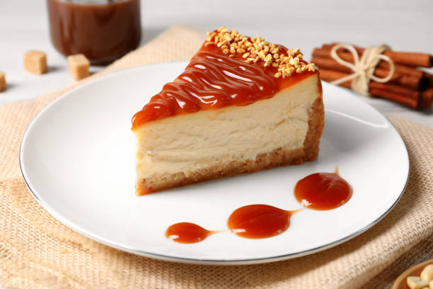 istock Tasty cheesecake with caramel and nuts served on table 1728503907