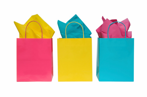 Multi colored shopping bags with tissue. Set against a pure white background.More shopping bags: