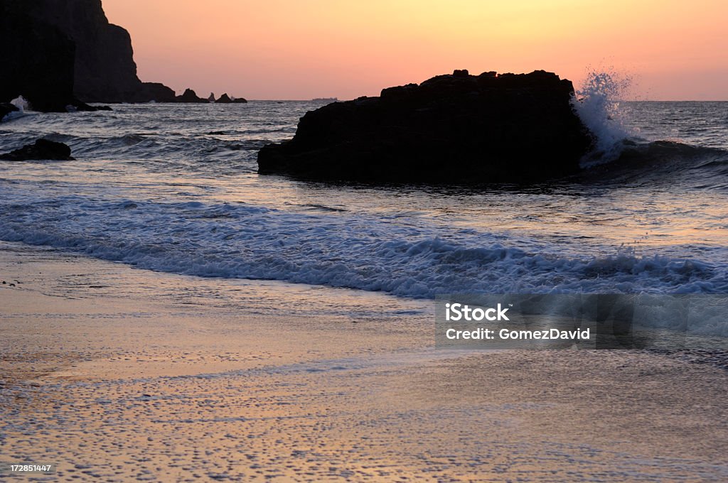 Pacific Coast Sunset Sunset along the rocky shore of the Pacific Ocean outside of the San Francisco Bay. Bay of Water Stock Photo