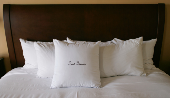 Sweet Dreams embroidered on pillows.